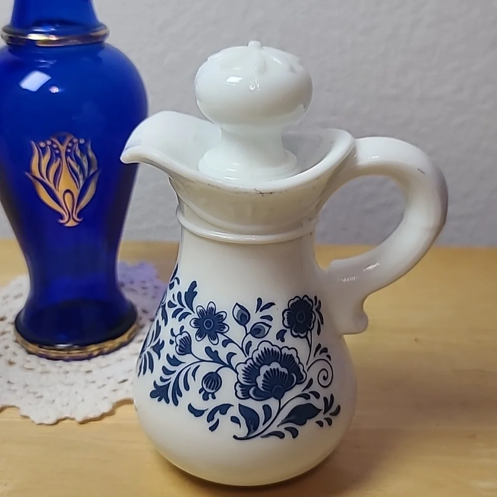 Avon set of three milk glass and blue glass pitcher.